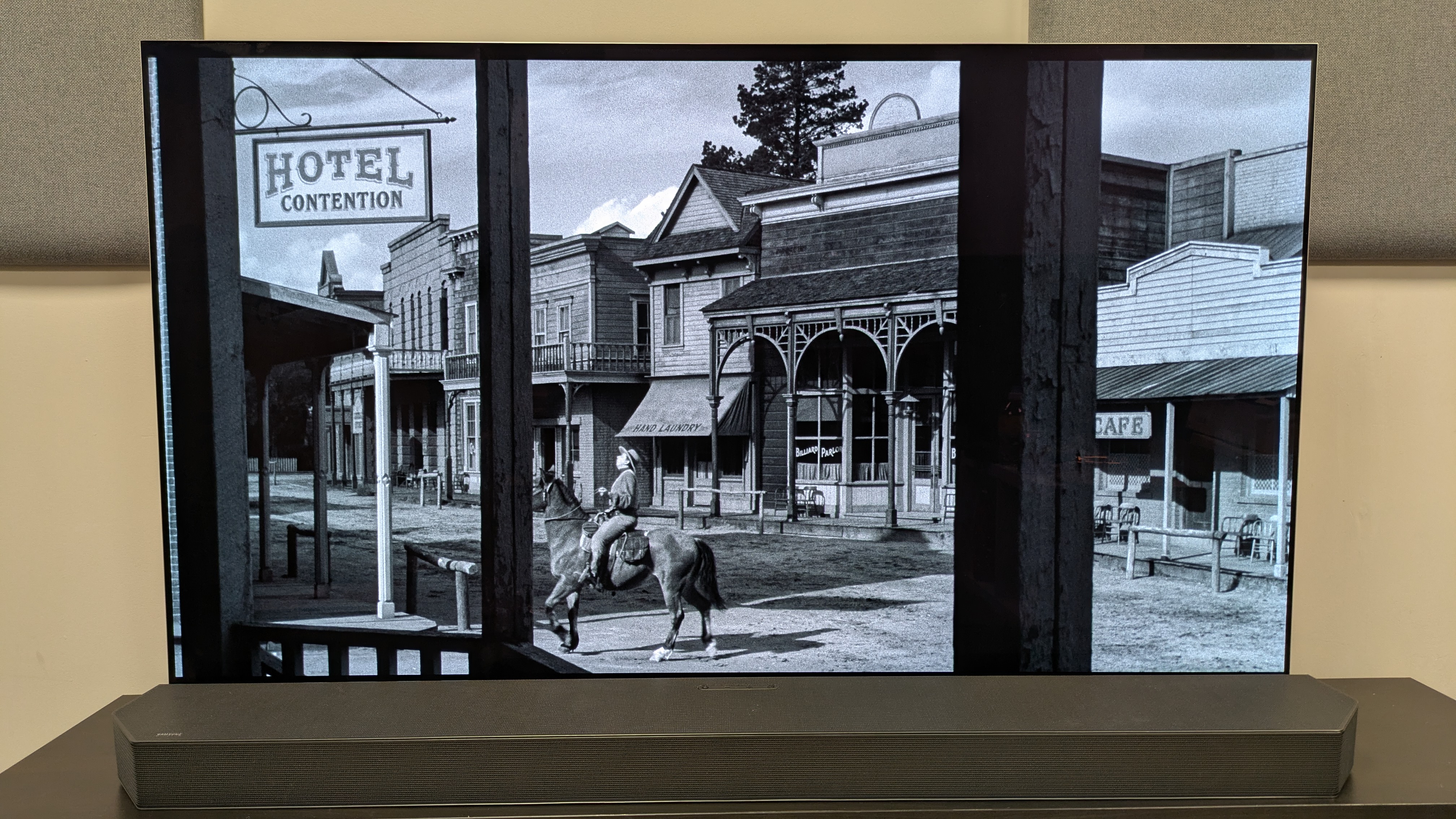3:10 To Yuma 4K Blu-ray on LG G5 OLED showing a man on horseback in a town 