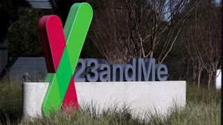 23andMe logo and branding pictured on a sign outside the company headquarters in Sunnyvale, California.
