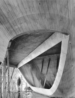 A black and white photo of Zaha Hadid's Phaeno Science Centre in Wolfsburg Germany.