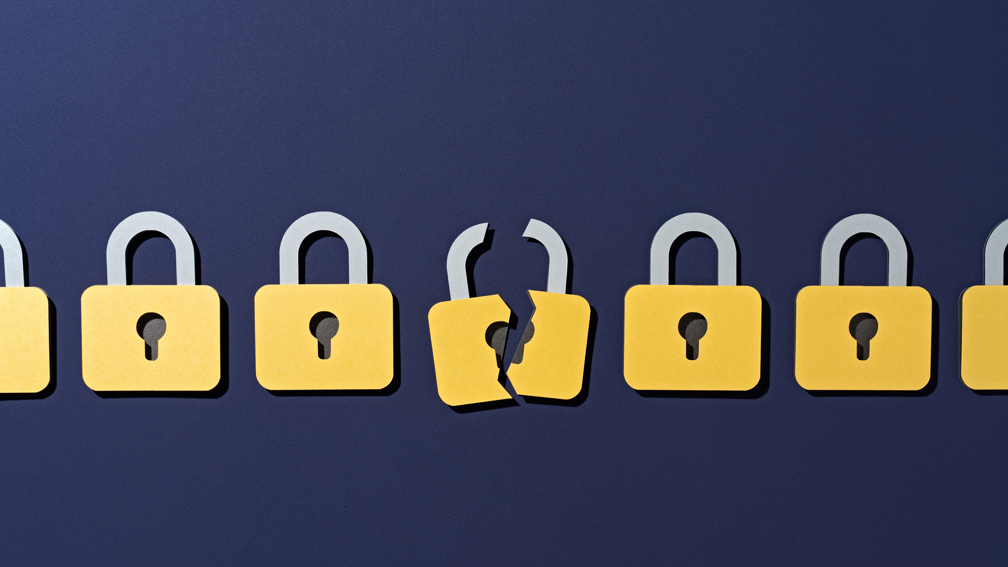 An illustration of a series of locks in a row against a dark blue background, with the middle lock broken in half vertically