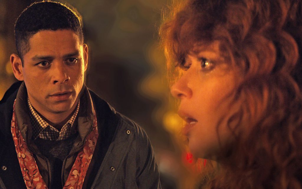 Charlie Barnett (as Alan) stares at Natasha Lyonne (as Nadia) who stares off camera in Russian Doll