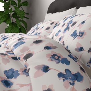 bed with floral quilt