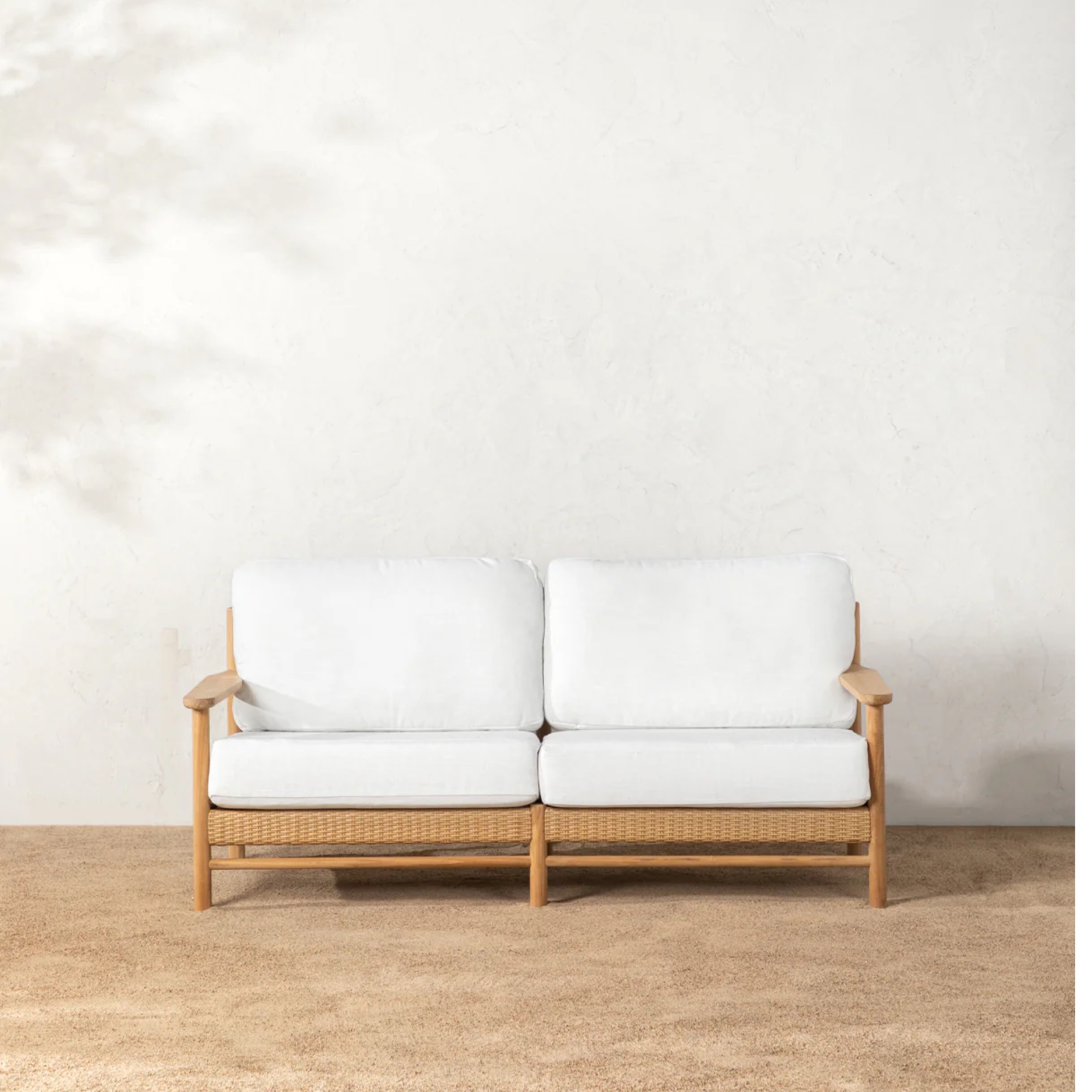 cream and teak outdoor sofa by McGee & Co