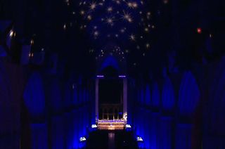 Washington National Cathedral lit for NASA and the National Air and Space Museum's "The Spirit of Apollo" event in Washington, D.C. on Tuesday, Dec. 11, 2018, including stars projected on its ceiling.