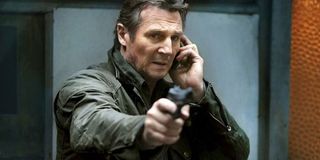 Liam Neeson pointing a gun in Taken