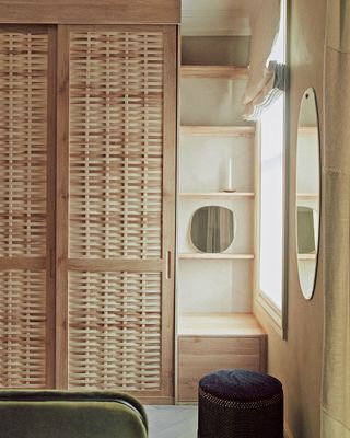 Beige bedroom with light wood wardrobe by Sebastian Cox