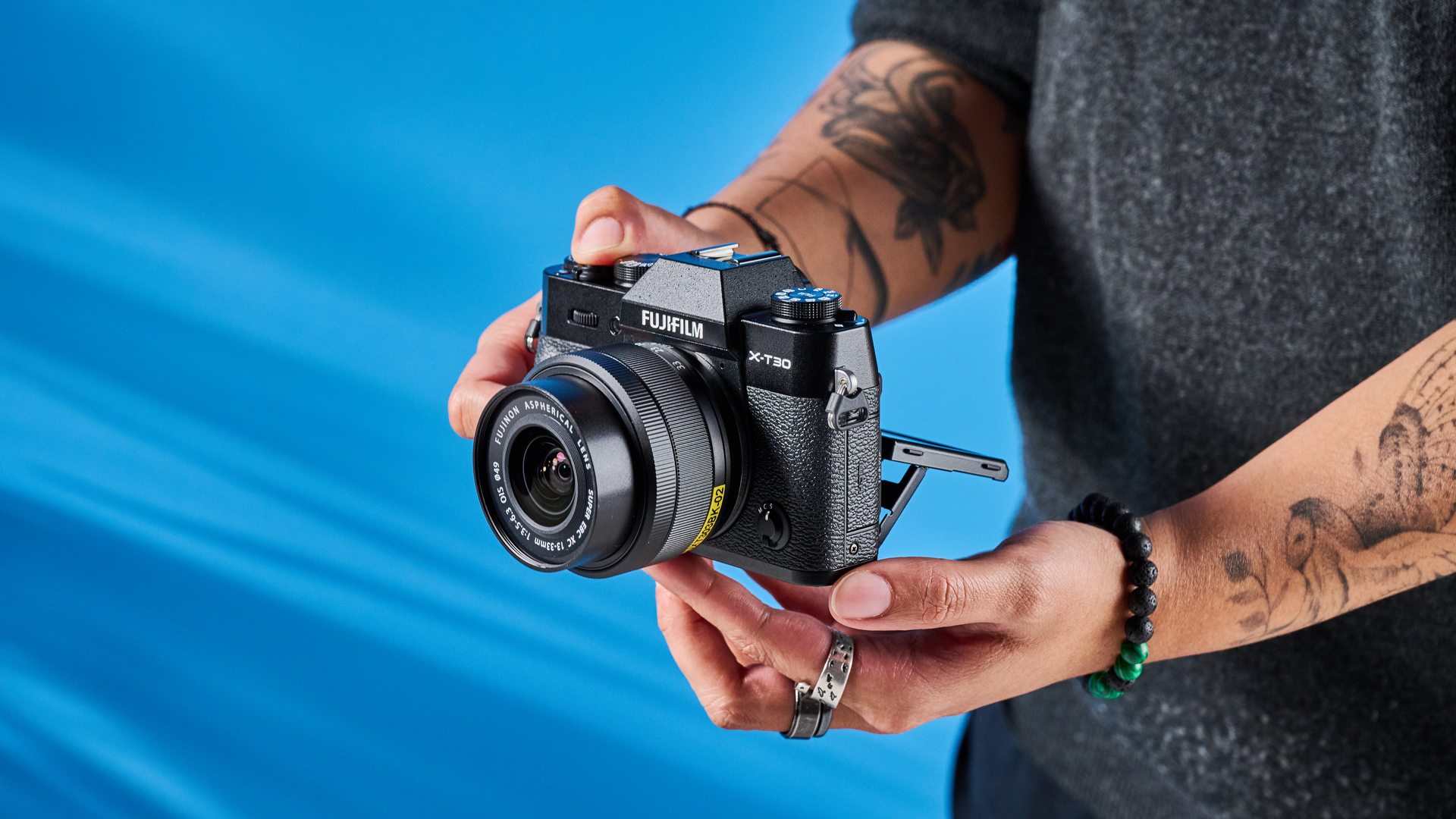 The Fujifilm X-T30 III in hand being used to shoot from the hip