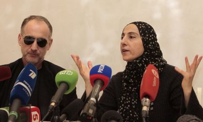 Zubeidat Tsarnaeva, the mother of the Boston bombing suspects, and the suspects' father Anzor Tsarnaev, speak at a news conference in Dagestan on April 25.
