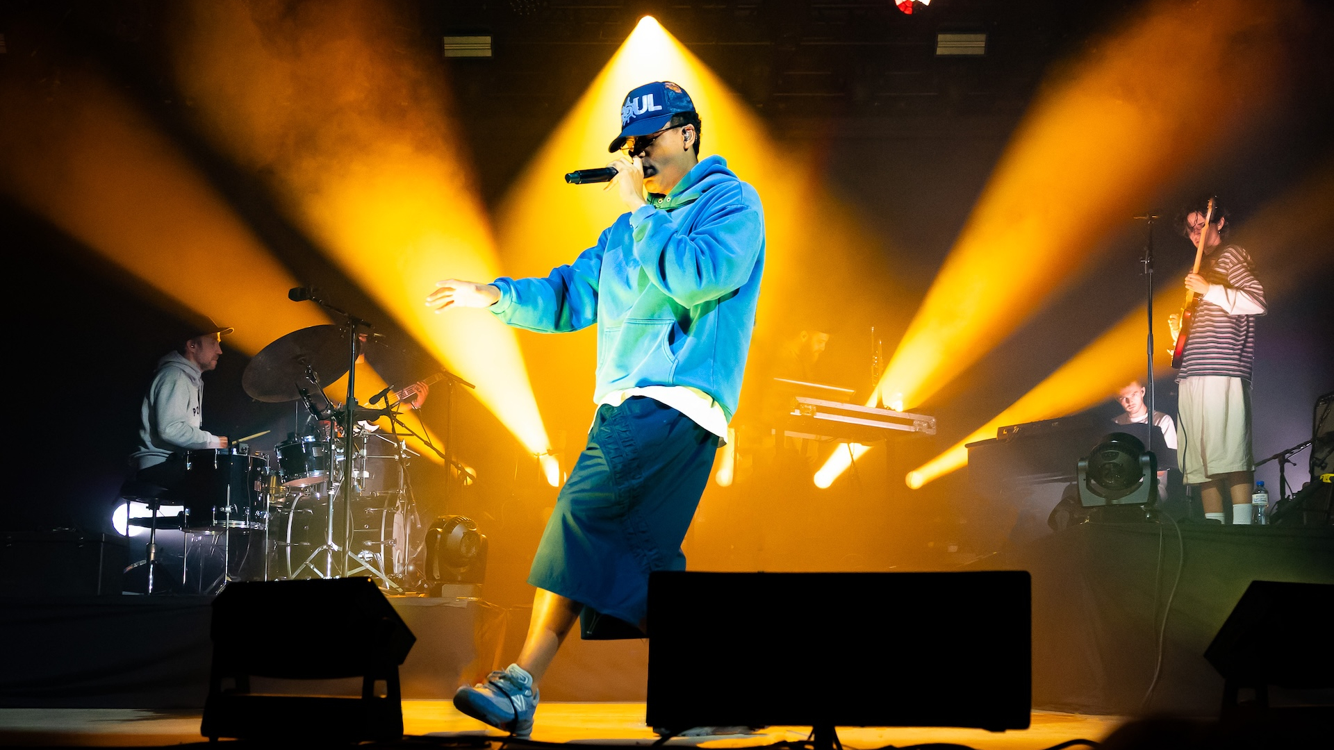 Loyle Carner performing on stage 