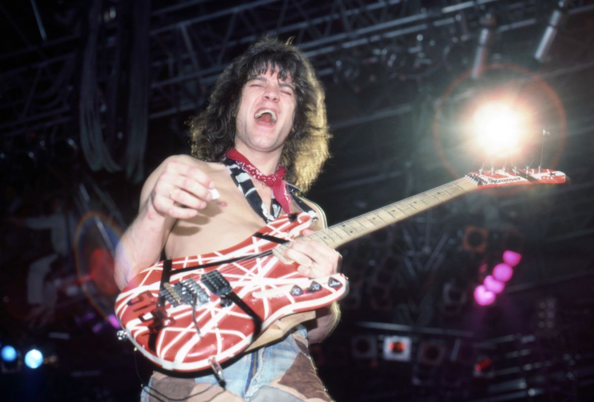 Eddie Van Halen plays his custom Kramer Frankenstrat guitar during a Van Halen show on April 5, 1984, in Detroit, Michigan.