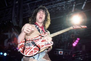 Eddie Van Halen plays his custom Kramer Frankenstrat guitar during a Van Halen show on April 5, 1984, in Detroit, Michigan.