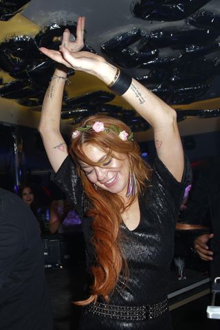 Lindsay Lohan DJs In The VIP Room Nightclub At The Cannes Film Festival 2014
