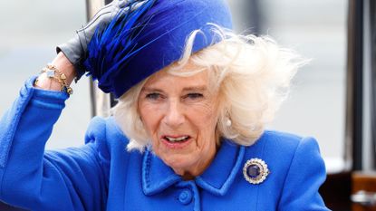 Camilla, Queen Consort holds onto her hat in the wind as she attends the 2023 Commonwealth Day Service at Westminster Abbey on March 13, 2023 in London, England. The Commonwealth represents a global network of 56 countries, having been joined by Gabon and Togo in 2022, with a combined population of 2.5 billion people, of which over 60 percent are under 30 years old. 