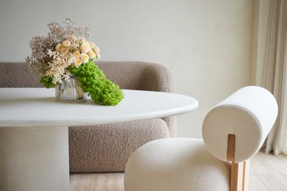 pretty flowers on a table in a neutral room