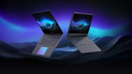 An upcoming Alienware laptop against a mountain background
