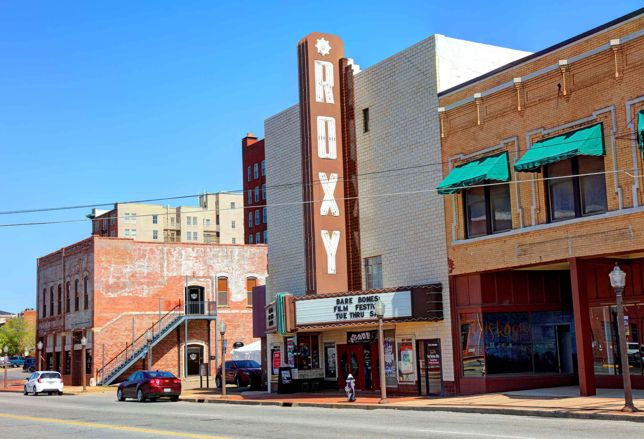 Muskogee, Oklahoma, USA - April 27, 2018: Daytime view of the front entrance to the multi-purpose Roxy Theater along Okmulgee Ave in the downtown district
