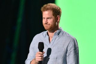Prince Harry speaking into a microphone