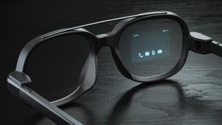 Lunettes AR posées sur une table avec un écran sur les verres donnant à l'utilisateur la possibilité d'appeler, d'envoyer un message, d'obtenir un itinéraire ou de prendre une photo.