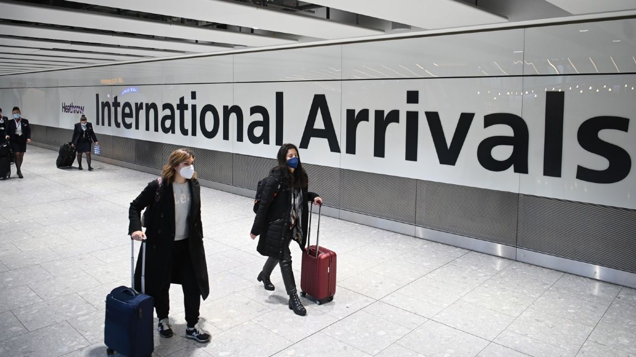 Airline passengers arrive at Heathrow Airport in London 