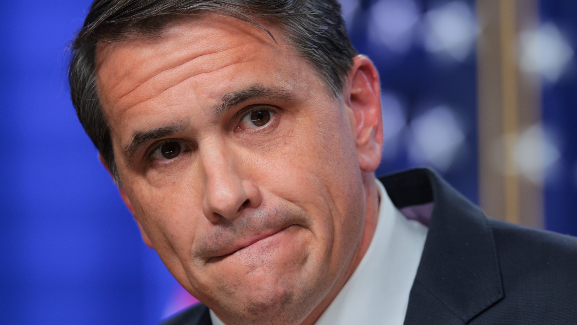 Acting U.S. Attorney General Todd Blanche takes questions and bites his lip