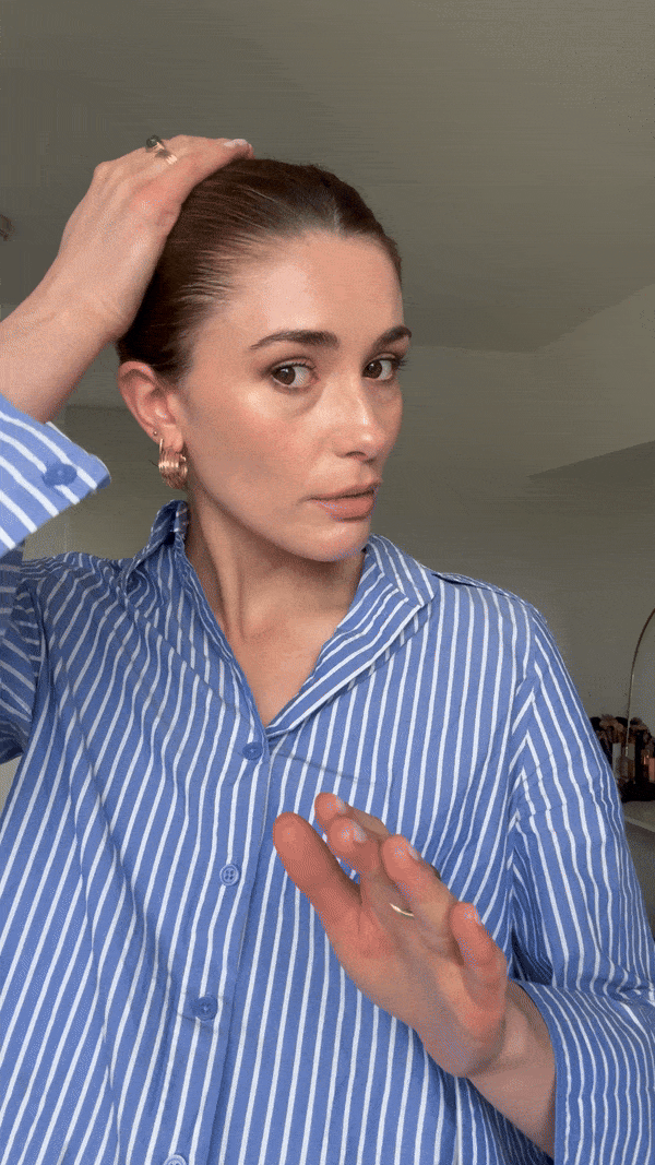 Using the Djerf Avenue On The Go Styling Gel to create a slicked-back bun