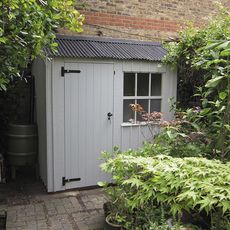 shed with white wall and graden area