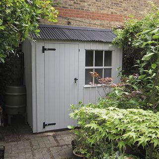 shed with white wall and graden area
