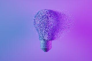 An abstract render of a lightbulb slowly dissolving on a blue and purple background