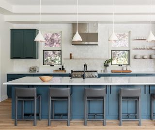 blue and white kitchen with island and grey bar stools