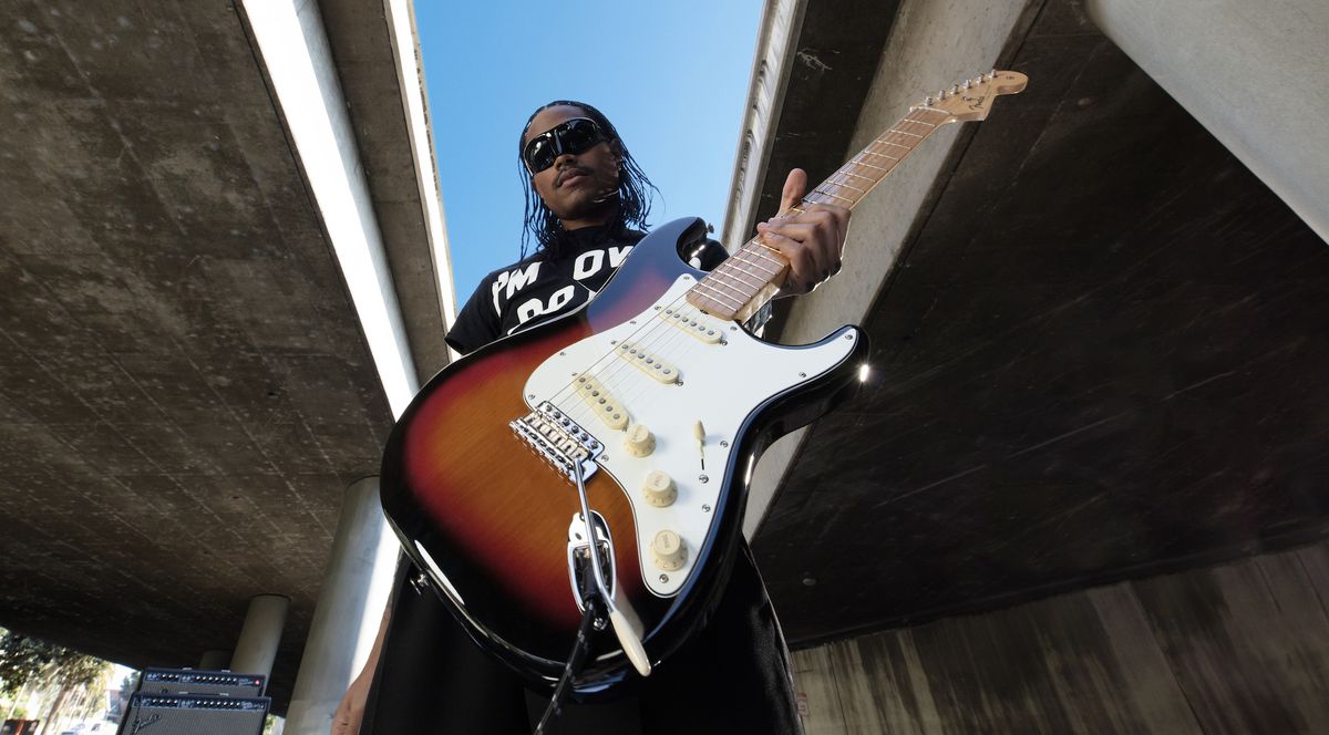 Steve Lacy holds his new signature Fender &quot;People Pleaser&quot; Stratocaster