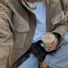 woman wearing suede jacket with jeans