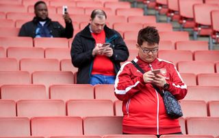 Arsenal fans on phones