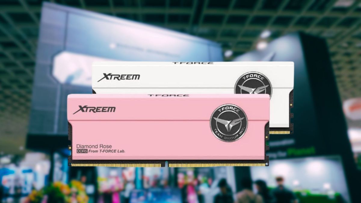 T-Force's new pink and white RAM modules in front of a blurred image of the brand's computex booth