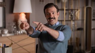 Ted Lasso enthusiastically pointing both his fingers.