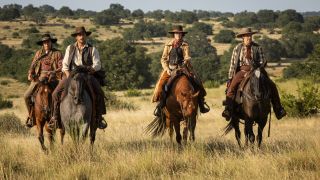 From left to right: Doug Hall as Two Spears, Brandon Sklenar as Spencer Dutton, Jennifer Carpenter as Marshall Mamie Fossett and Steve Luna as Deputy Clint Peterson riding horses in 1923. 