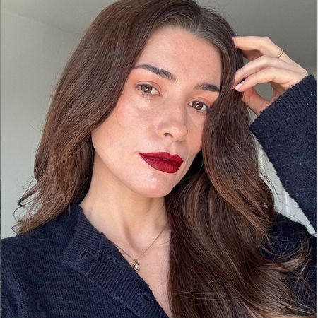 A selfie of Eleanor wearing red lipstick