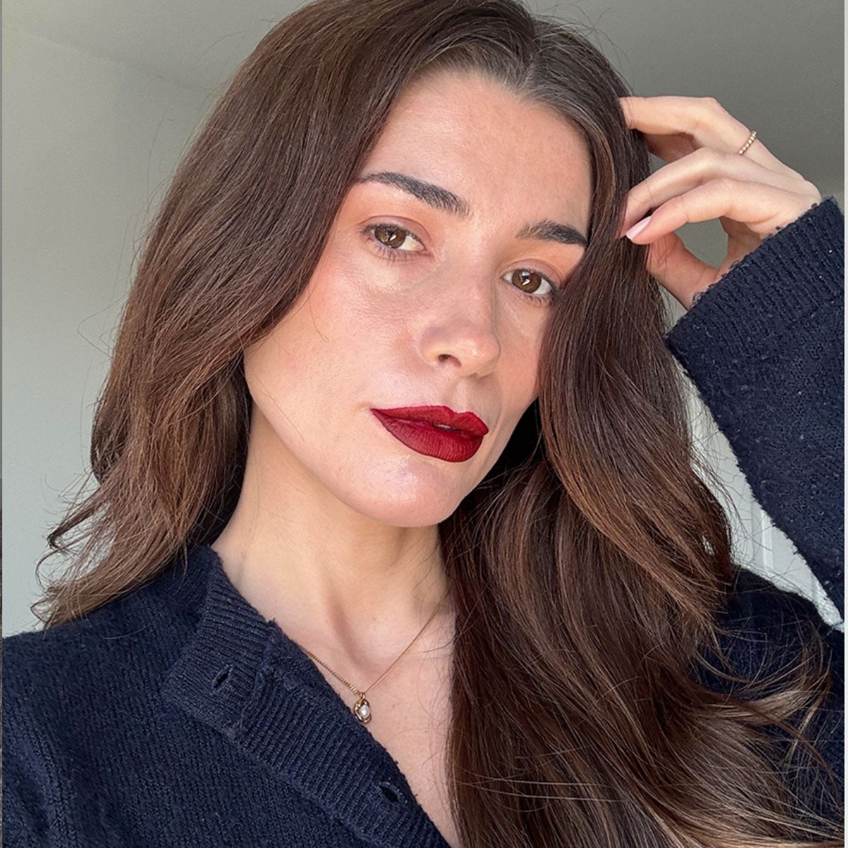 A selfie of Eleanor wearing red lipstick