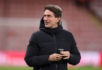 BOURNEMOUTH, ENGLAND - JANUARY 07: Thomas Frank manager / head coach of Tottenham Hotspur holding a cup with the Arsenal club badge on ahead of the Premier League match between Bournemouth and Tottenham Hotspur at Vitality Stadium on January 07, 2026 in Bournemouth, England. (Photo by Catherine Ivill - AMA/Getty Images)