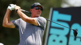 Phil Mickelson takes a tee shot at the 2023 LIV Golf Bedminster tournament