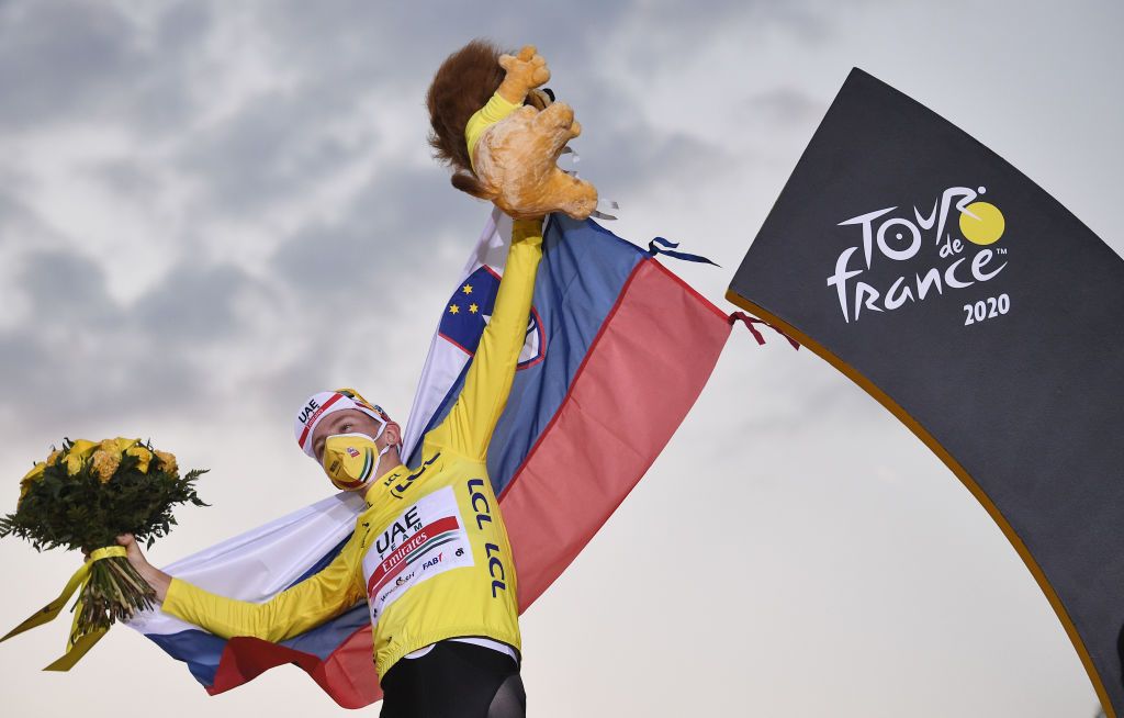 Team UAE Emirates rider Slovenias Tadej Pogacar wearing the overall leaders yellow jersey celebrates on the podium after winning the 107th edition of the Tour de France cycling race after the 21st and last stage of 122 km between ManteslaJolie and Champs Elysees Paris on September 20 2020 Photo by AnneChristine POUJOULAT AFP Photo by ANNECHRISTINE POUJOULATAFP via Getty Images