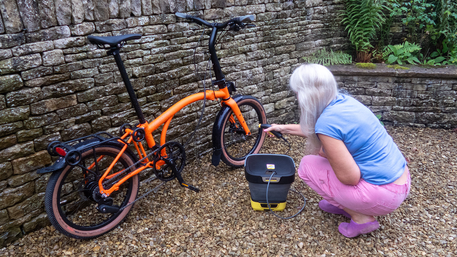 Kärcher Mobile Cleaner OC 3 Foldable being used to wash a Brompton bike.