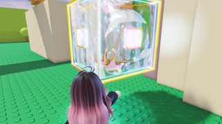 A player touches a large 3D Roblox Tilt icon in the Roblox The Hunt 20 hub.