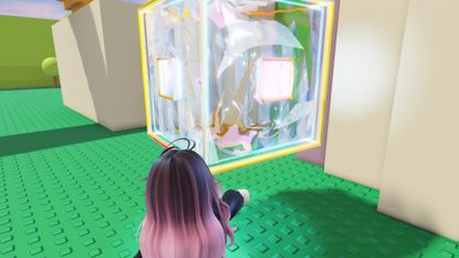 A player touches a large 3D Roblox Tilt icon in the Roblox The Hunt 20 hub.
