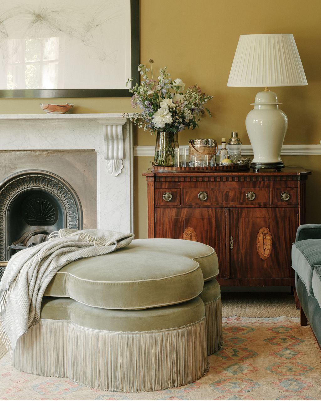 How to expertly style throw blankets to make your cozy spaces look more ... - Cozy Minimalist Living Room Throw Blankets