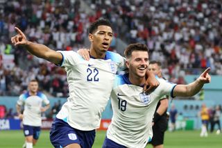 Jude Bellingham of England celebrates with Mason Mount after scoring their team's first goal during the FIFA World Cup Qatar 2022 Group B match between England and IR Iran at Khalifa International Stadium on November 21, 2022 in Doha, Qatar.