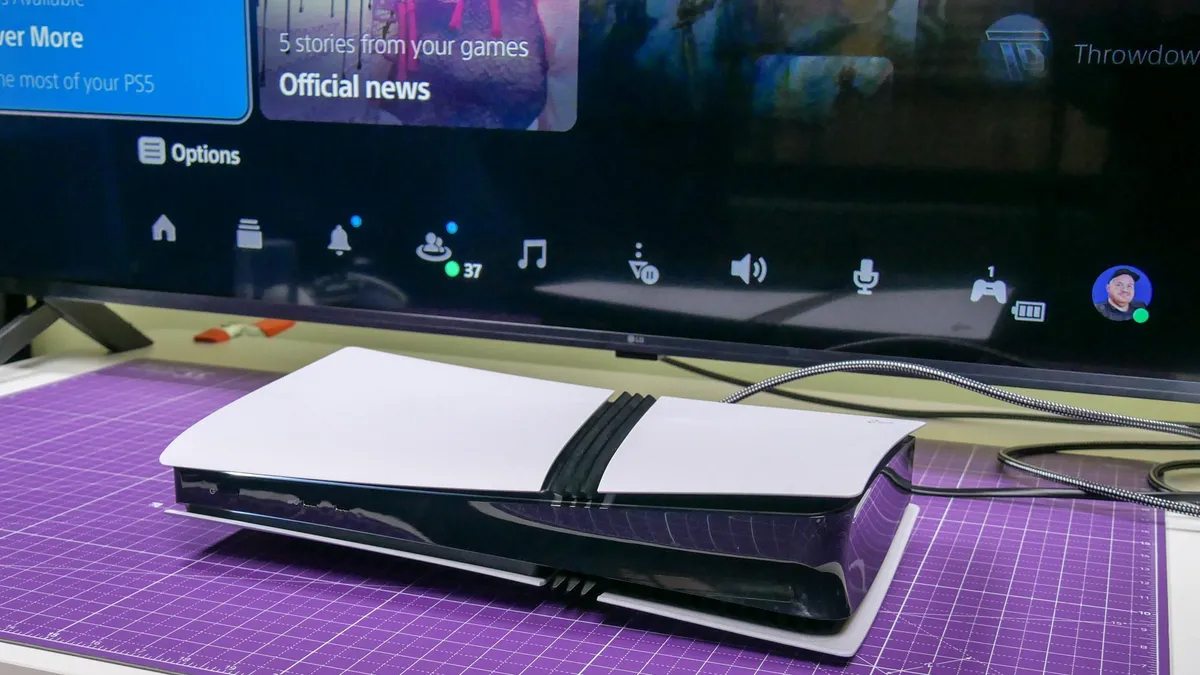 PS5 Pro console on a table in front of TV screen