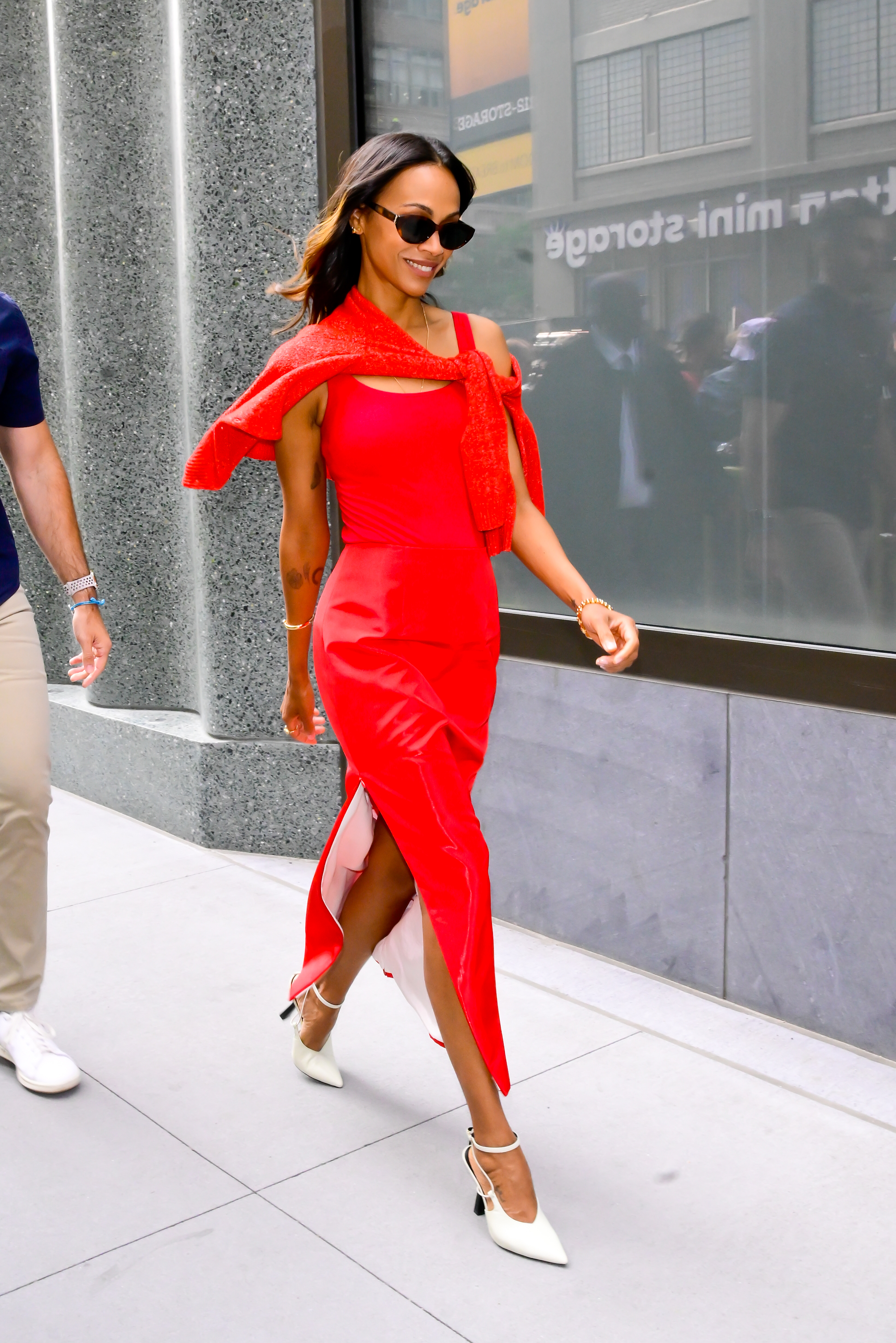 Zoe Saldaña wears a cherry red skirt set in New York.
