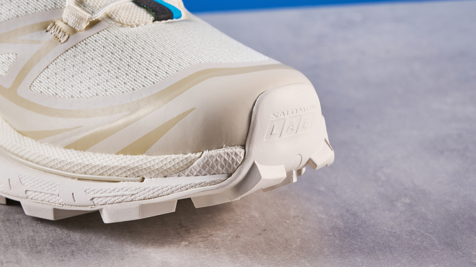 Salomon XT-6 in Vanilla Ice photographed in front of a blue background