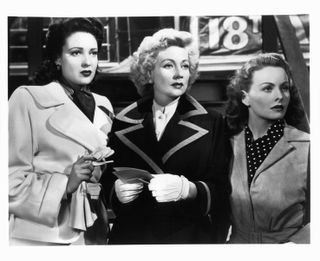 Jeanne Crain, Linda Darnell, and Ann Sothern in coats standing on a city street in the movie A Letter to Three Wives