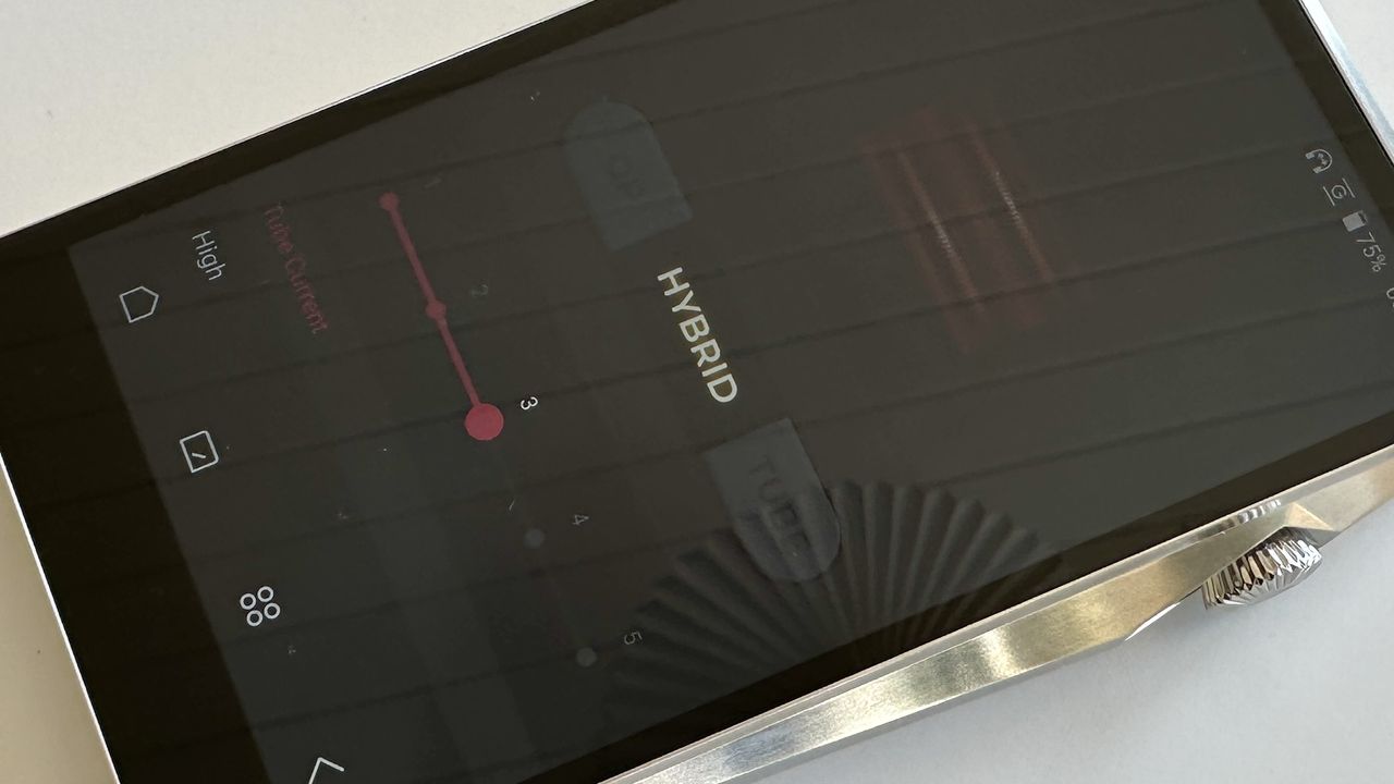 The Astell &amp; Kern A&amp;ultima SP3000T portable music player in hybrid mode, with red glowing vacuum tubes